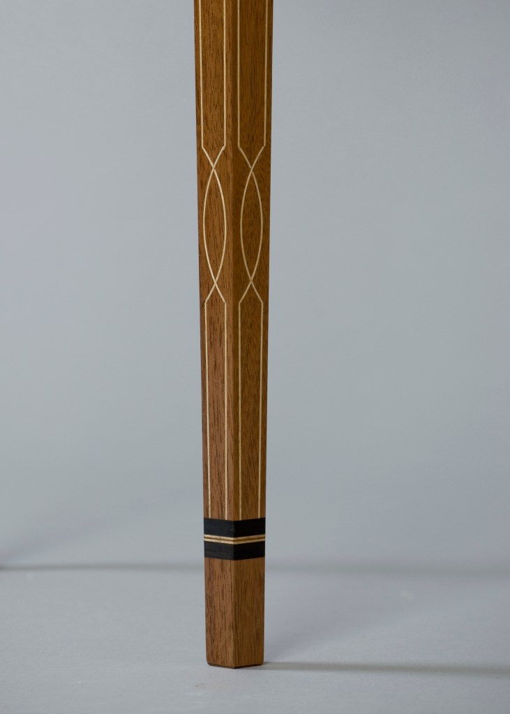 Toe detail of demilune table